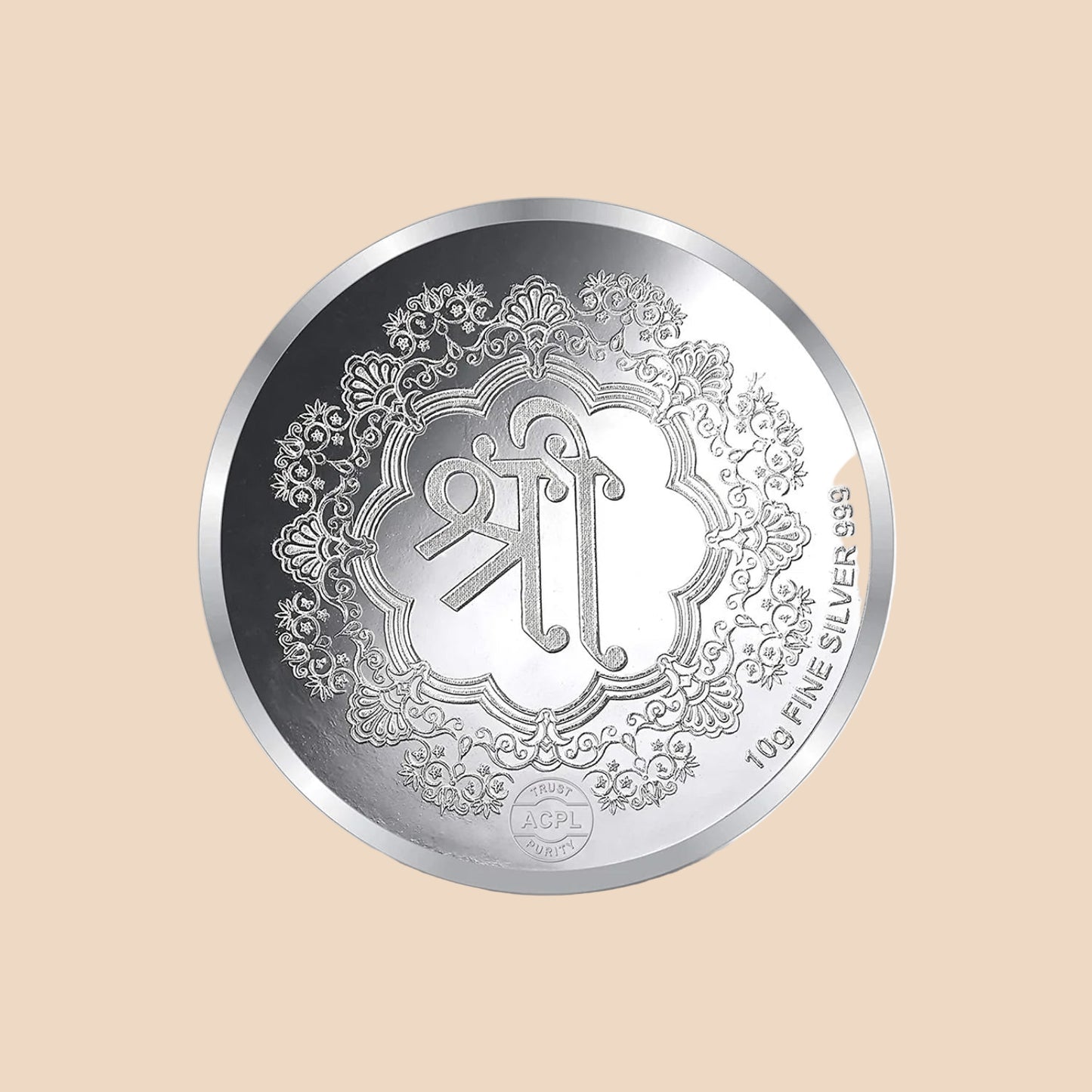 Silver coin with intricate design and branding on a white background
