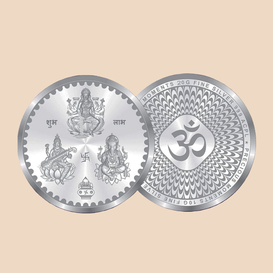 Silver coin with religious symbols on a dark purple background