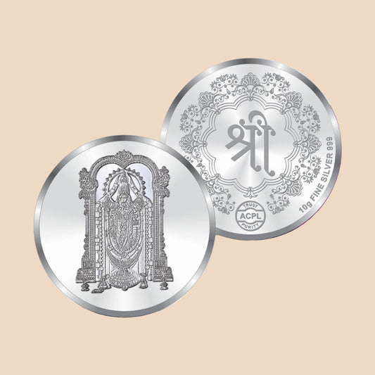 Two silver coins with intricate designs on a white and purple background