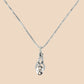 Silver necklace with a pendant on a light gray background
