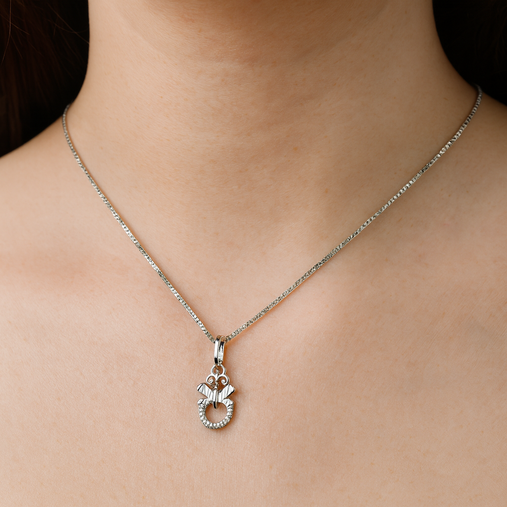 Silver necklace with a pendant on a person's neck