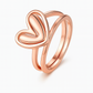 Rose gold heart-shaped ring on a white background
