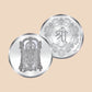 Two silver coins with intricate designs on a white and purple background